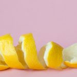lemon peel on pink background as a symbol of recycling circulate